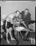 Sugar Ray Robinson receives physical exam before fight