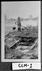 Photograph of a man next to a pit, Columbia County, Georgia, 1948 July 4