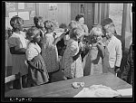 Second and third grade children being made up for their Negro song and dance at May Day-Health Day festivities. Ashwood Plantations, South Carolina