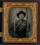 [Unidentified soldier in Confederate uniform with double barrel shotgun, Bowie knife, and two pistols]