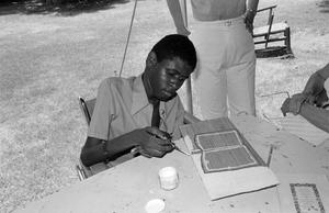 A boy making a painting