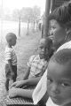 Woman and young boys in the bleachers at a baseball game, probably in Montgomery, Alabama.