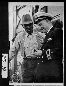 Photograph of Rear Admiral Richard E. Hawes and friend on Jackson Street, Thomson, McDuffie County, Georgia, ca. 1946