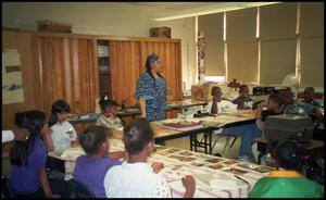 Woman in Blue and Students in Gates Elementary Classroom