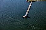 An October 2017 aerial view of Portland, Maine's, harbor, with a focus on the [Spring Point Ledge Lighthouse] in South Portland