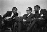 Congressman Carl Elliott seated with two other men during a meeting of educators at Alabama State College in Montgomery, Alabama.