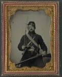 [Unidentified soldier in Union uniform and Company B hat, with Hall breech loading carbine rifle, Colt revolver, and cavalry sword]