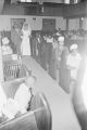 Josephine Bradford being escorted by her father during down the aisle at Holt Street Baptist Church in Montgomery, Alabama, during her wedding to Walter Bradley.