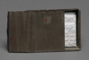 Freedom papers and handmade tin carrying box belonging to Joseph Trammell