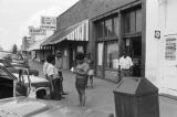 James "Son" Thomas and Joe Cooper, Leland, Mississippi. Street scene, cafe. (JTP 6-76-3)