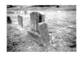 Mt. Olivet Cemetery: small marker leaning against larger tombstone