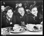 [Untitled photo shows: three boys at school lunch in New York]