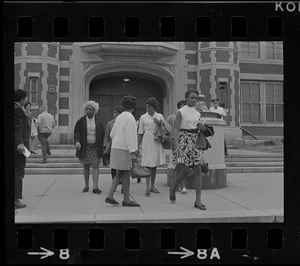 Black women exiting East Boston High School during the time of student demonstrations