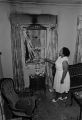 Minnie Gaston looking at the damage done to her home in Birmingham, Alabama, after it was firebombed.