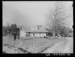 [Untitled photo, possibly related to: Negro family (rehabilitation clients) on porch of new home they are building near Raleigh, North Carolina]