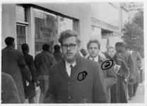 Mississippi State Sovereignty Commission photograph of Tougaloo College students Joseph Sittler, Jr., Marvin Hochstedler, Deborah Keehn and Albert Garner (left to right) standing in front of a Western Union storefront with other demonstrators during an Anti-Vietnam War demonstration protesting Secretary of Defense Robert McNamara's visit to Jackson, Mississippi, 1967 February 24