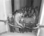 Ribbon cutting ceremony for the Tumbling Waters Museum of Flags exhibit, on a staircase at the Alabama Department of Archives and History in Montgomery, Alabama.