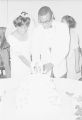 Josephine Bradley and Walter Bradley cutting the cake at their wedding reception in Montgomery, Alabama.