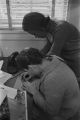 Amy Peppler and Viola Bradford working at the Southern Courier office in the Frank Leu Building in Montgomery, Alabama.