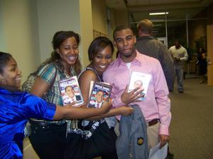 A group of students holding DVDs, 2