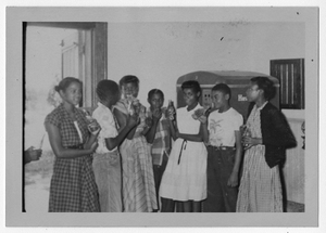 Thumbnail for Photograph of African American students gathered around a Coca Cola machine, Manchester, Georgia, 1953