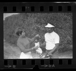 Golfer Lee Elder and his wife Rose on golf course in Los Angeles, Calif., 1969