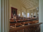 House of Representatives chamber inside the Old Capitol Building in Springfield, the capital city of Illinois. It is the fifth capitol building built for the U.S. state of Illinois. It was constructed in the Greek Revival style in 1837-1840 and served as the state house from 1840 to 1876. It is the site of presidential candidacy announcements by Abraham Lincoln in 1858 and Barack Obama in 2007. Here, Lincoln tried cases as a lawyer and delivered his famous "House Divided" speech in 1858