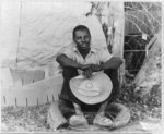 Negro field worker. Holtville, Imperial Valley, California. He has just made himself shoes out of that old tire