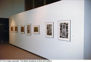 Photograph of an African gallery wall, featuring seven abstract art works