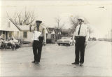 Two Montgomery policemen standing in the street during the Selma to Montgomery March.