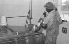 African American man pouring milk