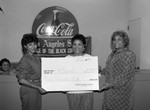 Thumbnail for Jessie Mae Beavers and others posing with a donation, Los Angeles, 1986