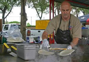 Man cooking quesadillas