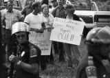 White demonstrators at the city limits of Cullman, Alabama, awaiting the arrival of a march organized by the Southern Christian Leadership Conference to protest the upcoming trial of Tommy Lee Hines.