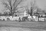 Students hanging laundry to dry on the grounds of the Alabama Industrial School for Negro Children in Mount Meigs, Alabama.