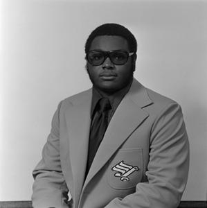 North Texas student with a blazer and glasses, 2