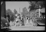 [Untitled photo, possibly related to: Some of the Negroes watching itinerant salesman selling goods from his truck in center of town. On Saturday afternoon. Belzoni, Mississippi Delta, Mississippi]