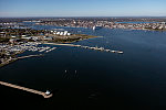 An October 2017 aerial view of Portland, Maine's, harbor, with a focus on the [Spring Point Ledge Lighthouse] in South Portland