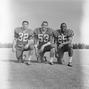 Three football players smiling, 3