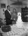 Cutting a wedding cake, Los Angeles, 1965