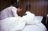 Doctor examining patient at a prison hospital