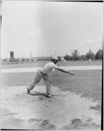 Coca-Cola Company-sponsored barbecue for African-American employees, Atlanta, Georgia, August 21, 1954. In this photo an African-American man is pitching in a baseball game