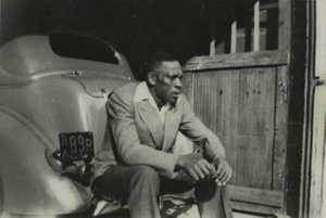 Young Howard Brown sitting on a car in Hackensack, New Jersey