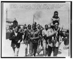 Thumbnail for A small band of Negro teenagers march singing and clapping their hands for a short distance here 3/9