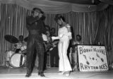 Marion and Pauline Sledge performing on stage with Bobby Moore and the Rhythm Aces at the Laicos Club in Montgomery, Alabama.