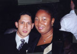 Two unidentified members of the Ethnic Alumni Association pose together during an event, 2001