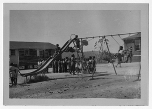 Photograph of African American students playing on a playground, Manchester, Georgia, 1953