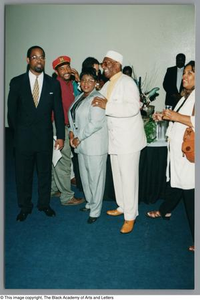 Photograph of Albert Lipscomb smiling with two men and two women