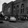 Damaged cars and debris beside 16th Street Baptist Church in Birmingham, Alabama, after the building was bombed.