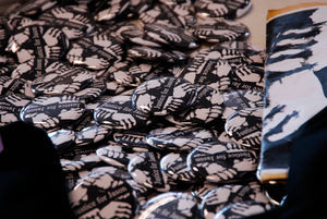 Justice for Jason rally at UMass Amherst: buttons and fliers in support of Jason Vassell